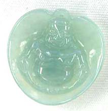 A jade buddha pendant in a shell